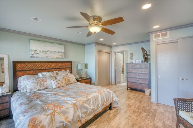 bedroom featuring ceiling fan, light wood-type flooring, and ornamental molding