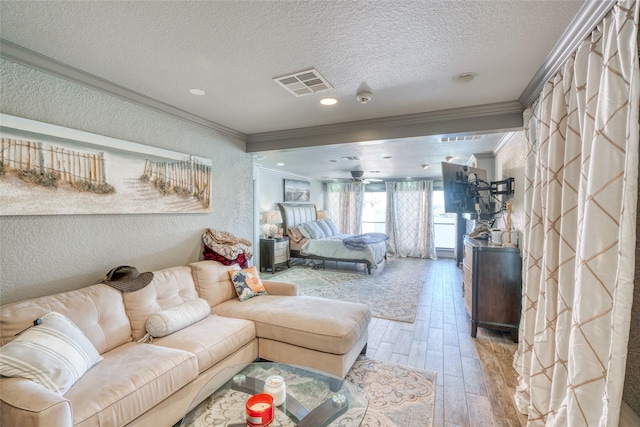 bedroom featuring ornamental molding and a textured ceiling