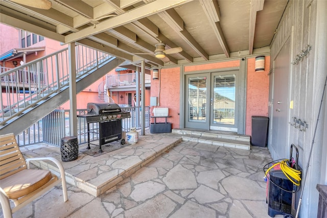 view of patio with ceiling fan and grilling area