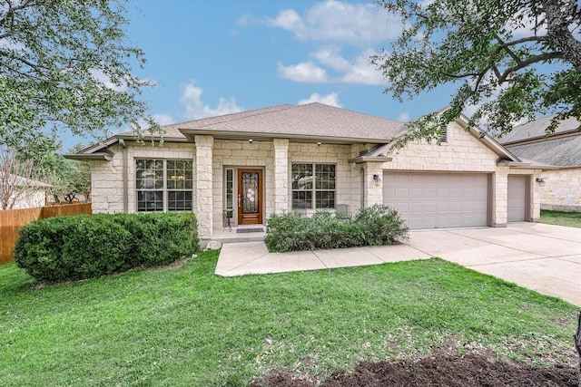 view of front of house with a front lawn and a garage