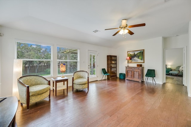 sitting room featuring ceiling fan and hardwood / wood-style floors