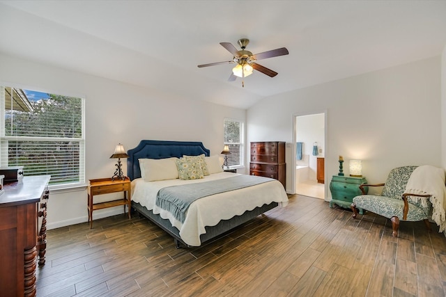 bedroom with ceiling fan, vaulted ceiling, and multiple windows