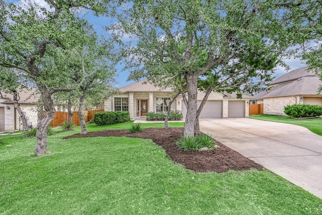 view of front facade featuring a front yard and a garage