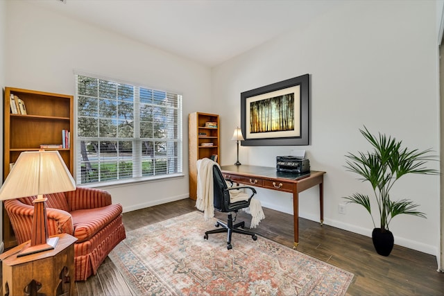 office space with dark wood-type flooring