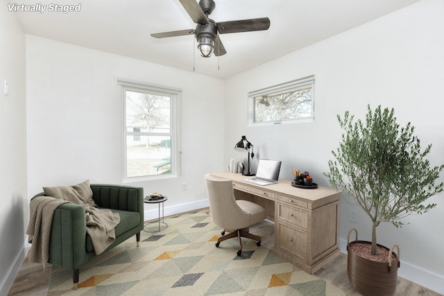 office space featuring ceiling fan and light hardwood / wood-style floors