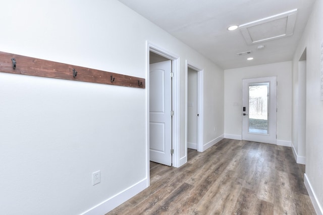 doorway with hardwood / wood-style flooring