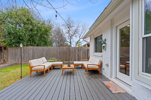 wooden terrace with an outdoor hangout area