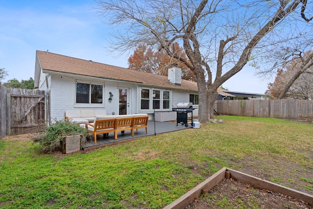 back of house featuring a yard and a patio area