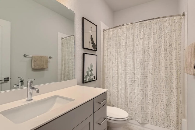 bathroom with toilet and vanity