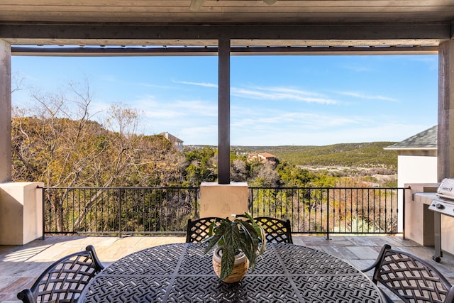 deck featuring ceiling fan and a patio