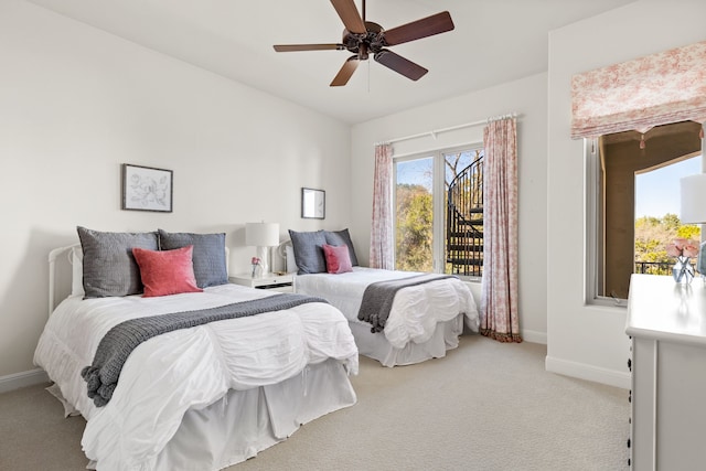 bedroom featuring light carpet and ceiling fan