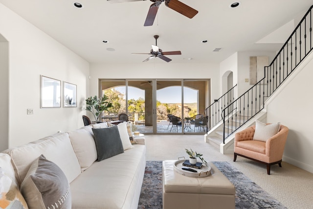 carpeted living room featuring ceiling fan