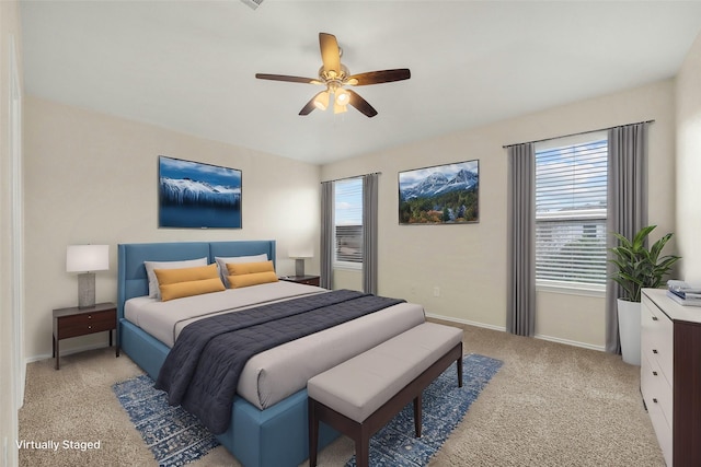 carpeted bedroom featuring ceiling fan