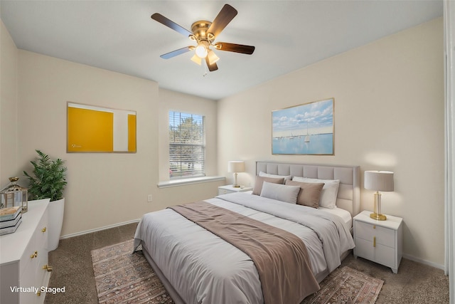 bedroom with ceiling fan and dark colored carpet