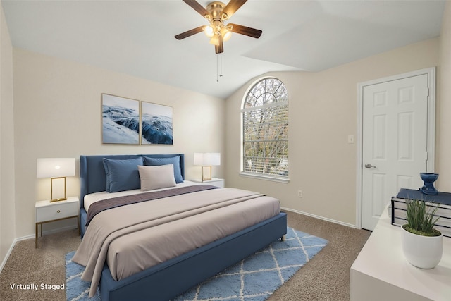 bedroom with dark carpet, ceiling fan, and vaulted ceiling