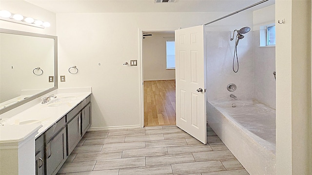 bathroom with shower / bathtub combination and vanity