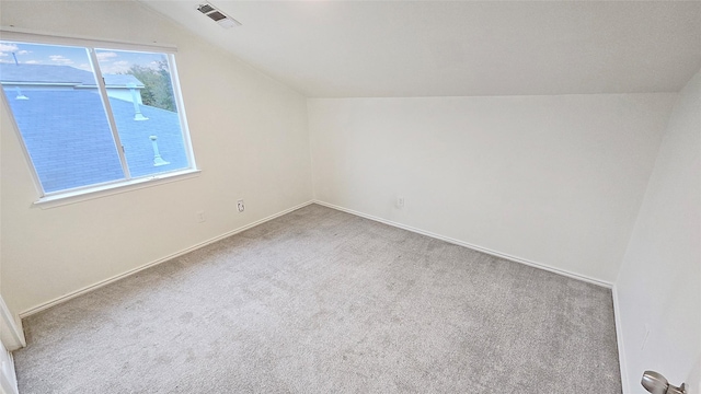 bonus room featuring lofted ceiling and carpet flooring