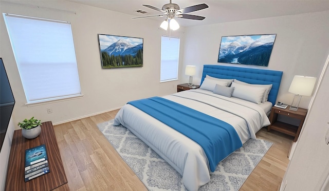 bedroom with ceiling fan and light wood-type flooring