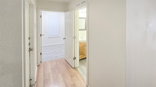 corridor featuring light hardwood / wood-style flooring