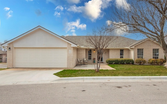 ranch-style house with a front yard and a garage