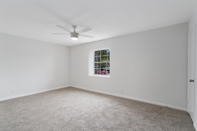 unfurnished room with carpet flooring and ceiling fan