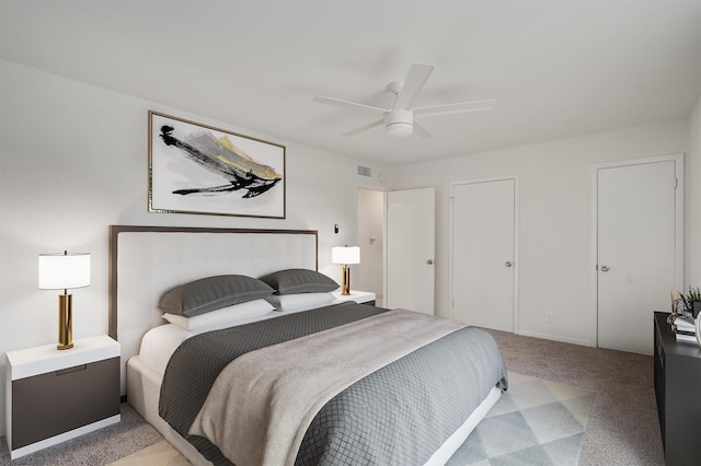 carpeted bedroom with ceiling fan