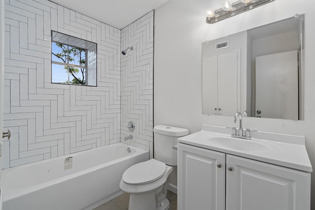 full bathroom with vanity, tile patterned floors, tiled shower / bath combo, and toilet