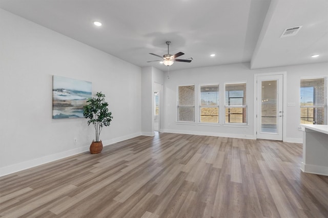 unfurnished living room with light hardwood / wood-style floors and ceiling fan