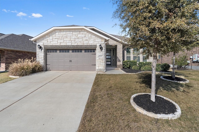 view of front of house featuring a garage and a front lawn