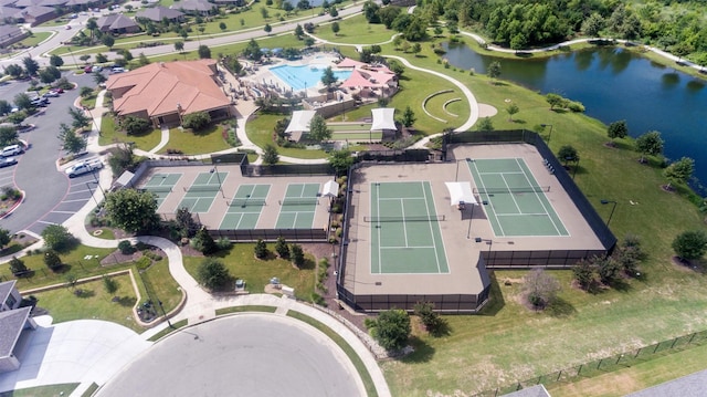 birds eye view of property with a water view