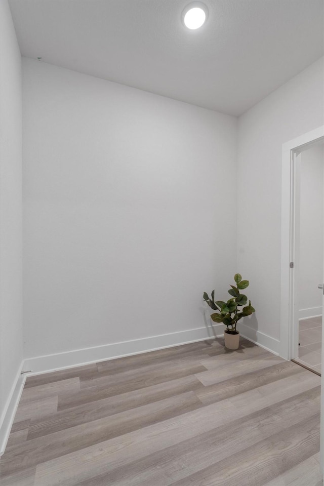 unfurnished room with light hardwood / wood-style flooring