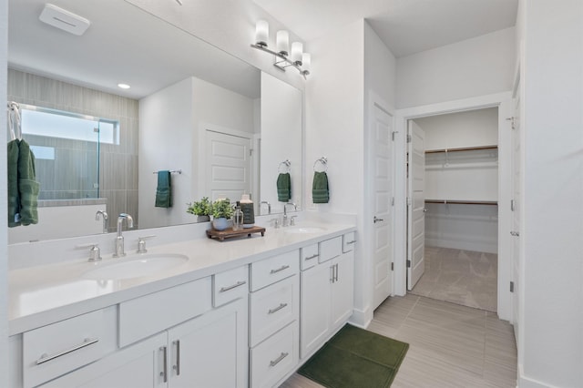 bathroom featuring tile patterned flooring and vanity