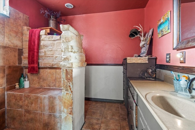 bathroom with tile patterned floors and vanity