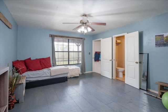 bedroom with ceiling fan, dark wood finished floors, and baseboards