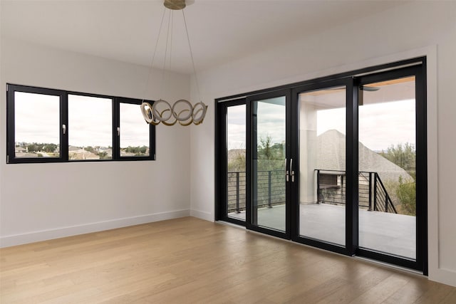 spare room with hardwood / wood-style flooring