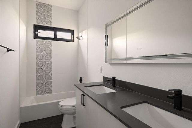 full bathroom featuring toilet, vanity, tile patterned floors, and shower / bathing tub combination