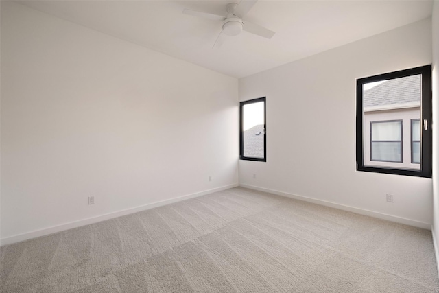 empty room with light carpet and ceiling fan