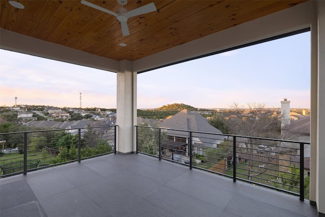 balcony at dusk with ceiling fan