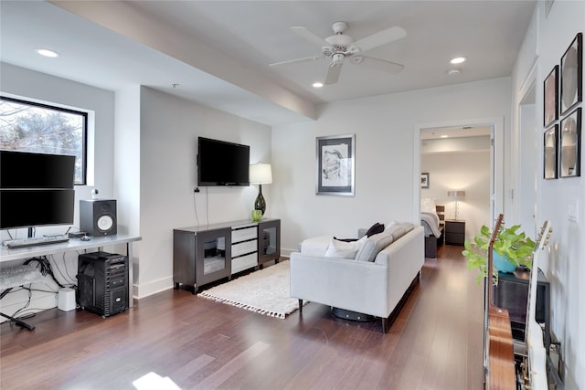 living room with ceiling fan and dark hardwood / wood-style floors