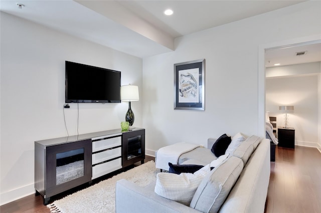 living room with dark hardwood / wood-style flooring