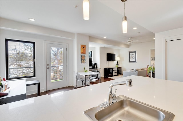 kitchen featuring sink, hanging light fixtures, and ceiling fan