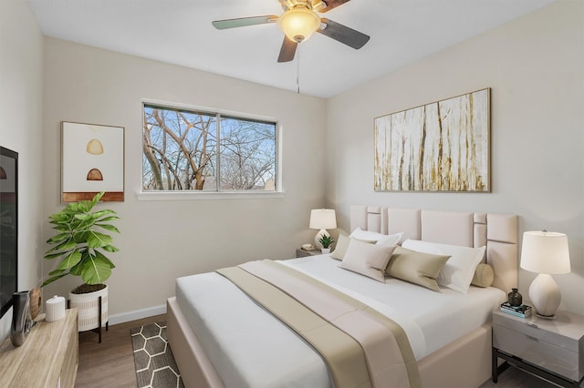 bedroom with ceiling fan and dark wood-type flooring