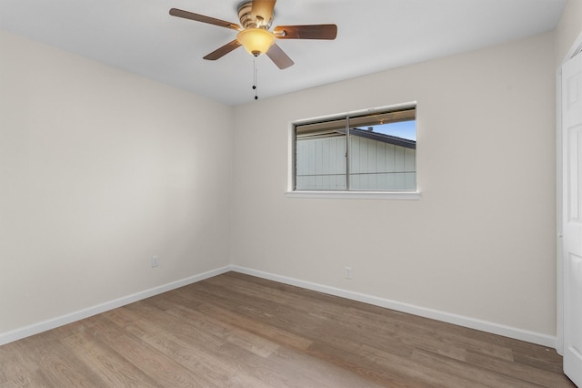 spare room featuring ceiling fan and light hardwood / wood-style floors