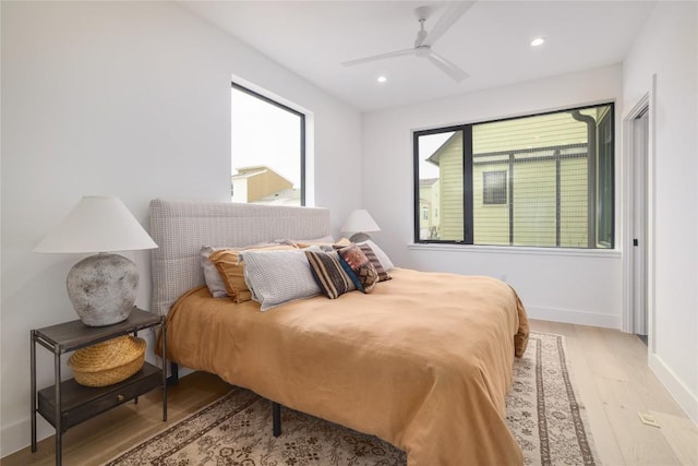 3008 Sorin St, Austin, TX 78723 - bedroom featuring wood finished floors, multiple windows, recessed lighting, baseboards, and a ceiling fan