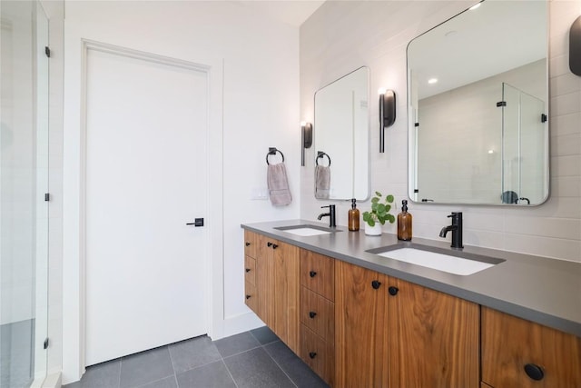 3008 Sorin St, Austin, TX 78723 - bathroom featuring a shower stall, tile patterned floors, and double vanity