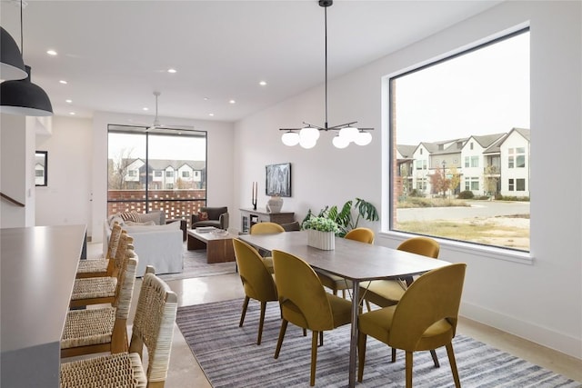 3008 Sorin St, Austin, TX 78723 - dining room featuring concrete floors, a chandelier, recessed lighting, and baseboards