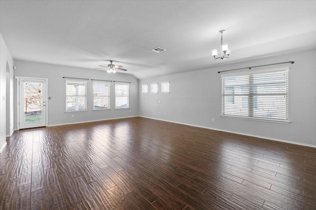 unfurnished room with ceiling fan with notable chandelier and dark wood-type flooring