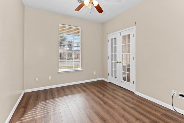 unfurnished room with ceiling fan, french doors, and dark hardwood / wood-style floors