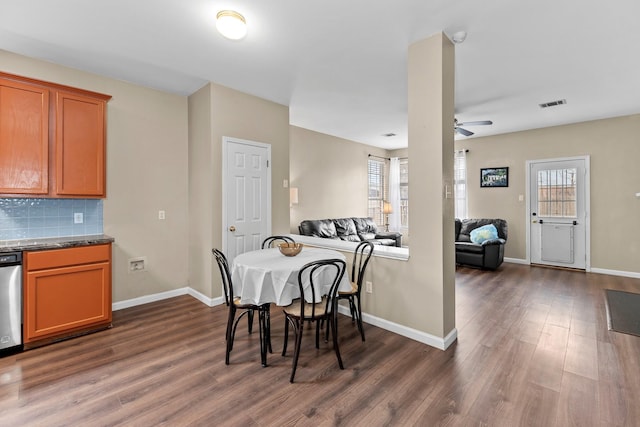 dining space with ceiling fan and dark hardwood / wood-style floors