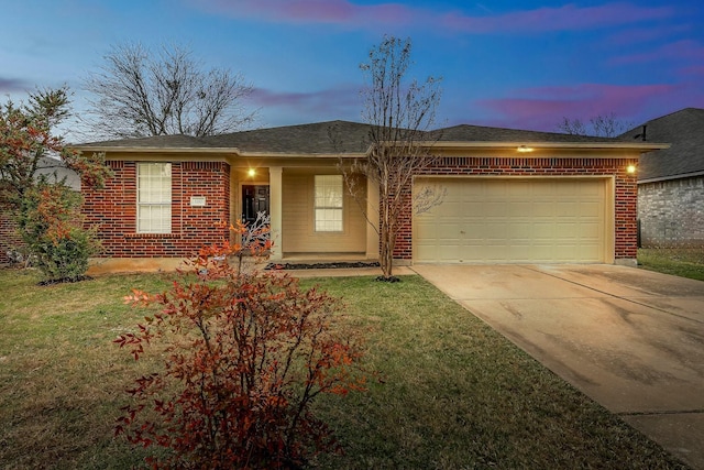 single story home with a yard and a garage